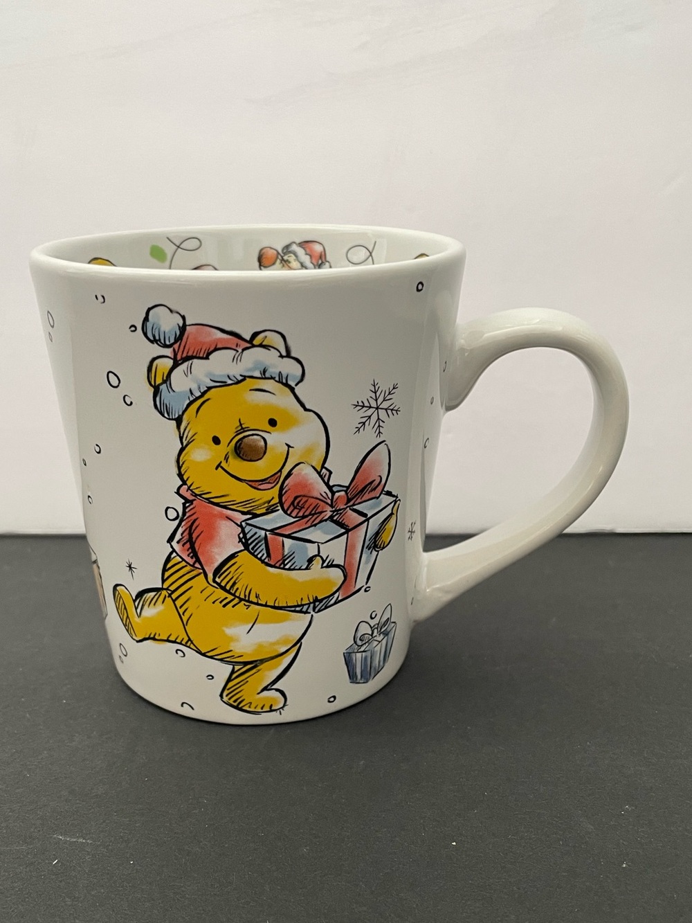 Disney Winnie the Pooh holiday mug featuring pooh, piglet, Tigger, and Eeyore